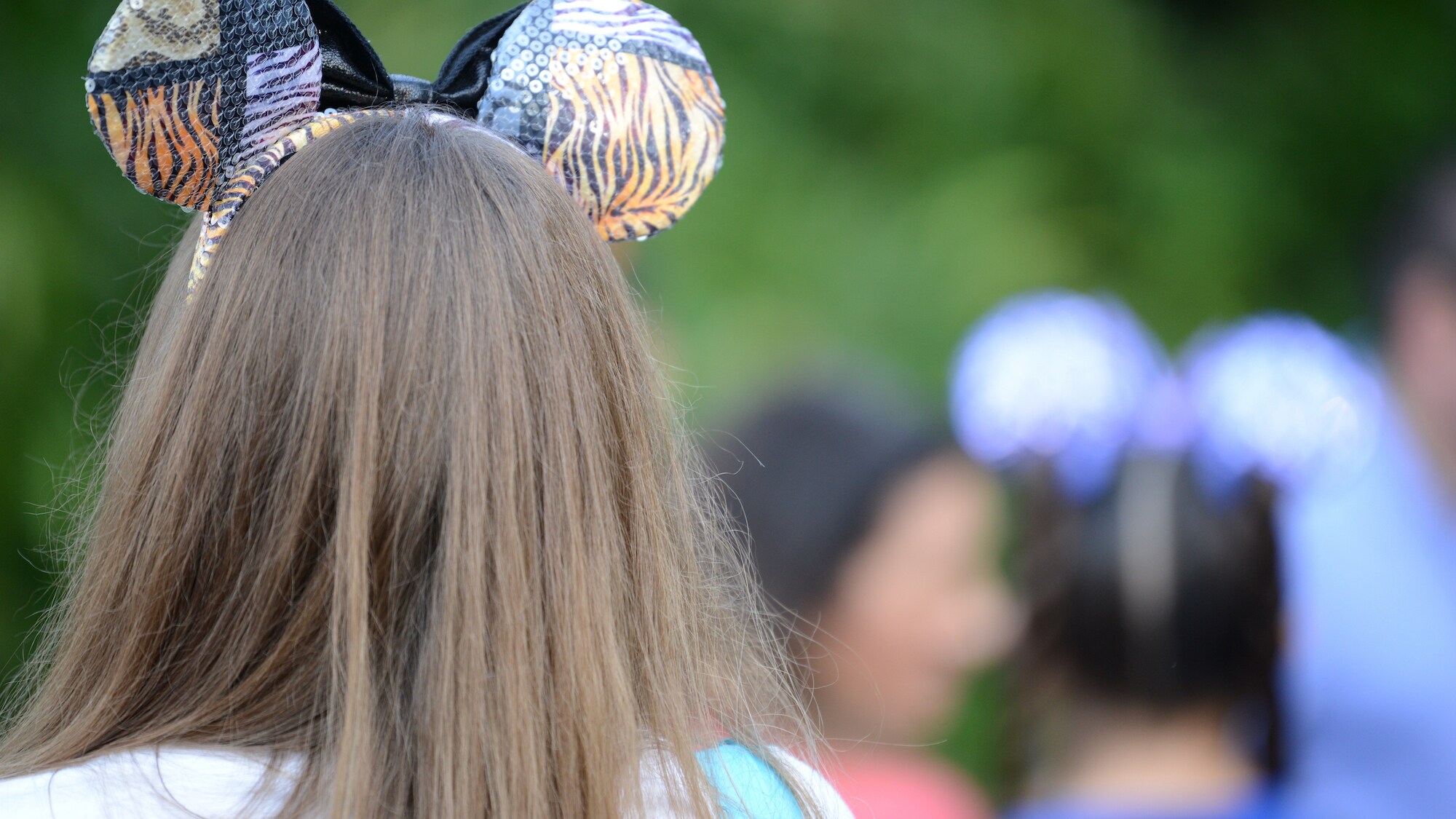 Guest wearing animal print Mickey Mouse ears. (National Geographic/Gene Page)