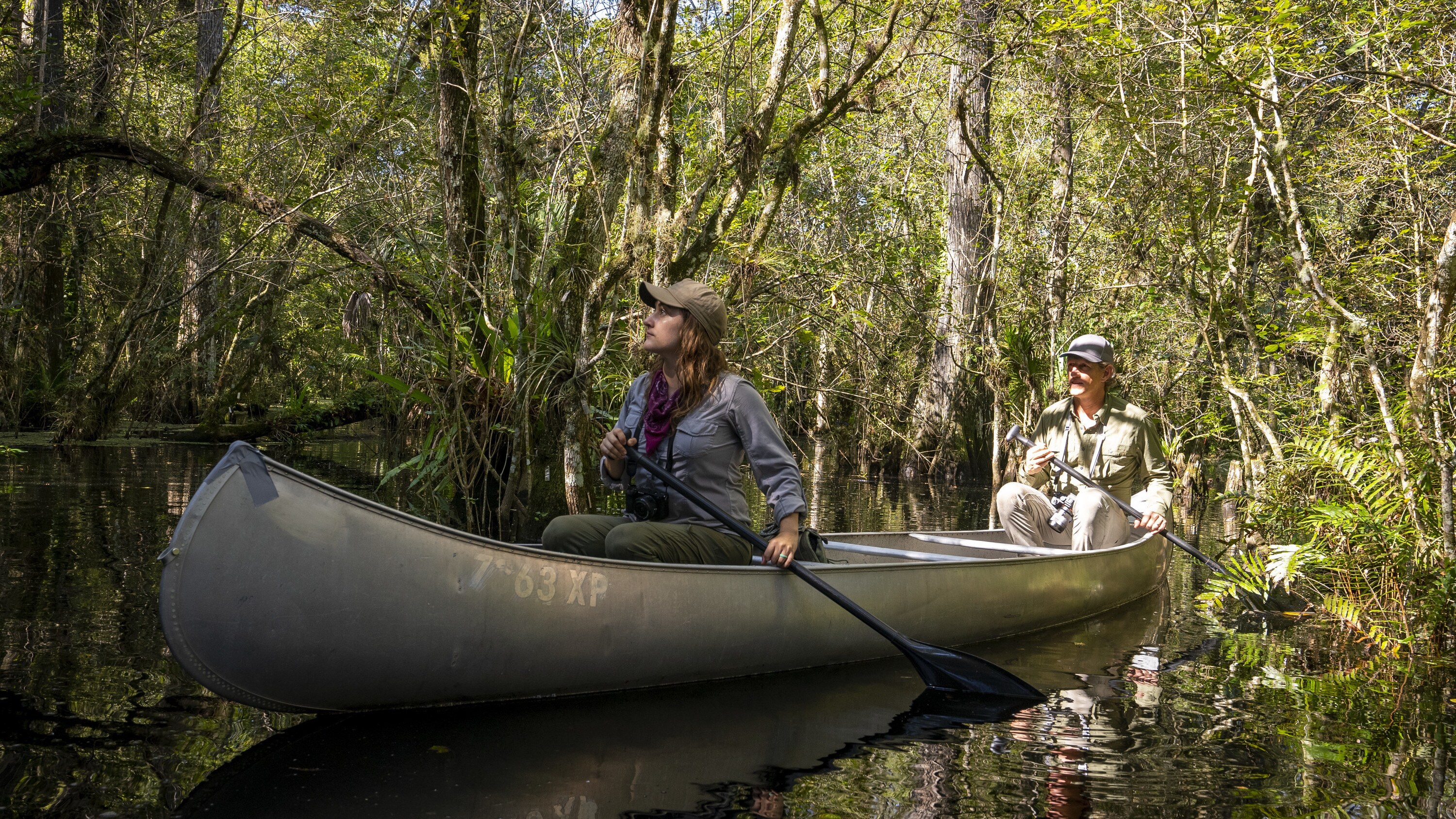 Carlton Ward and Malia Brytus canoe through the swamps of their native Florida.  (National Geographic/Austin Ferguson)