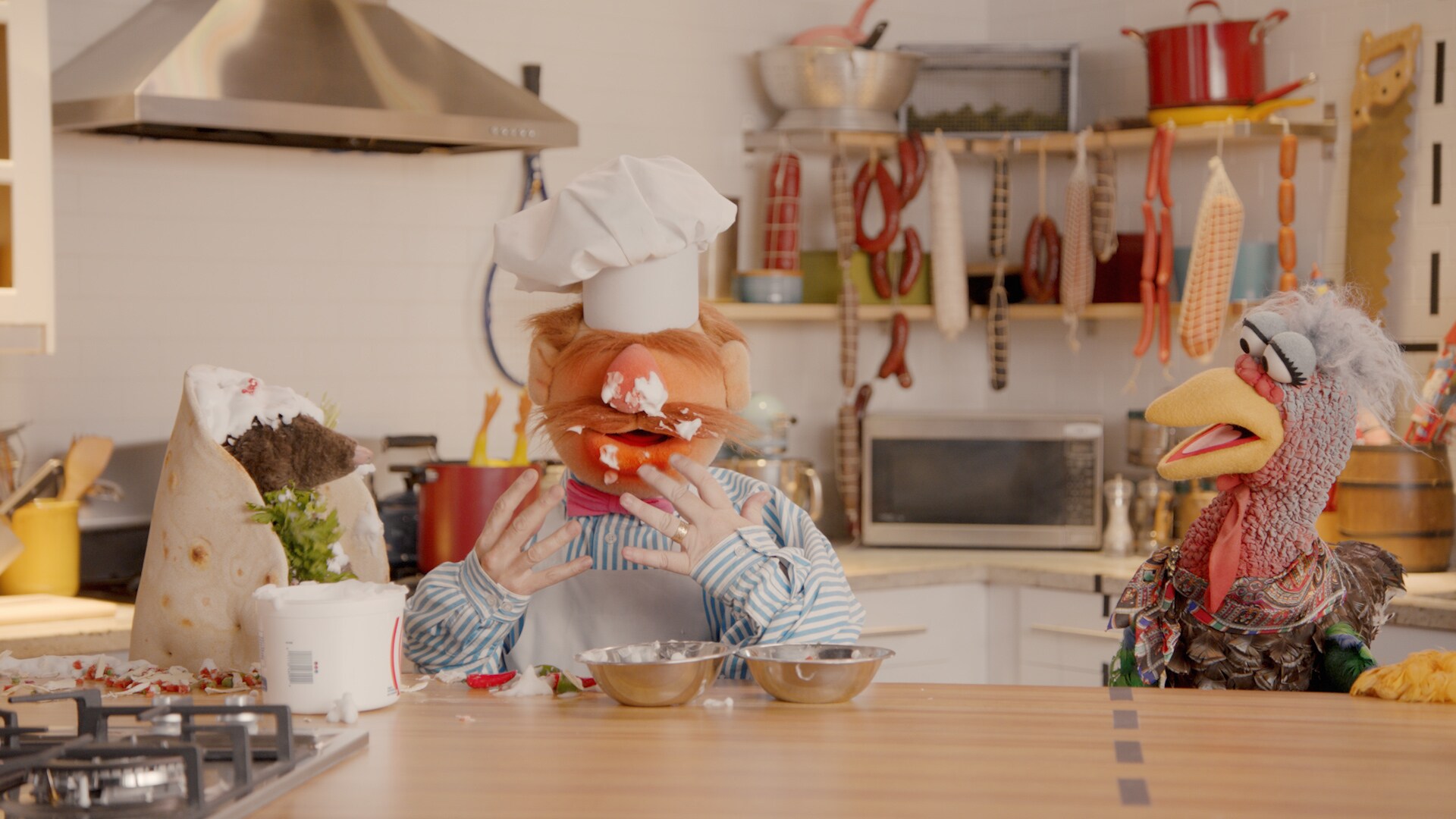 Swedish Chef and Beverly Plume in “Muppets Now,” streaming on Disney+