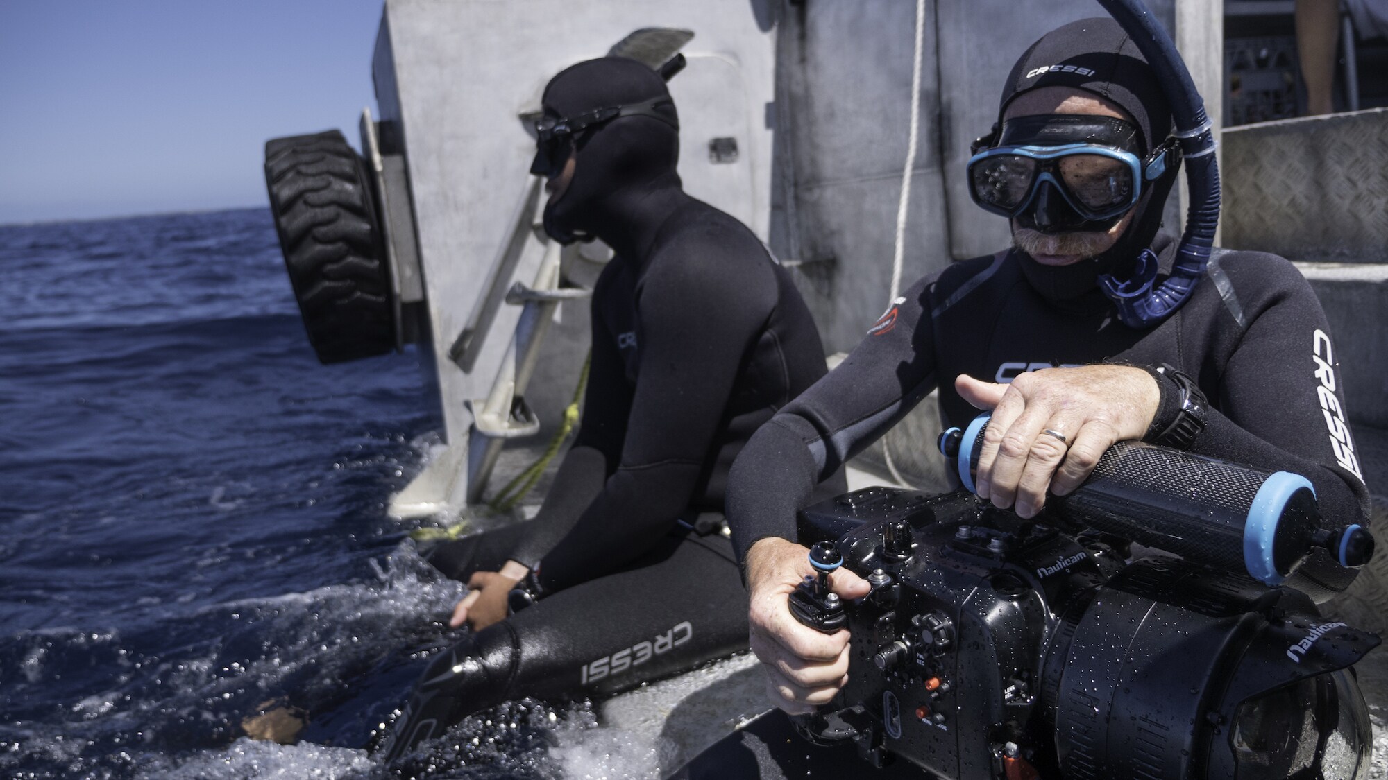 Underwater cinematographer Adam Geiger prepares to dive with humpback whales. (National Geographic for Disney+/Brian Armstrong)