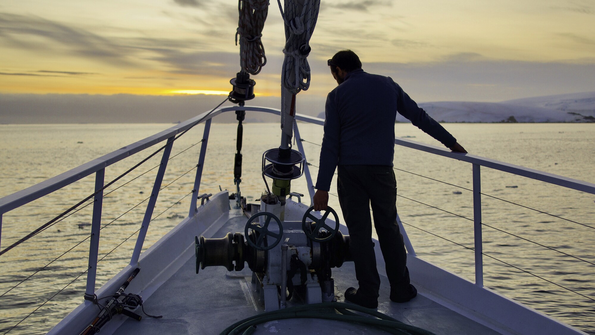 Director of Photography Hayes Baxley rests aboard The Australis expedition vessel in Antarctica. The Planet of the Whales team filmed for 45 days at the bottom of the world. (National Geographic for Disney+)