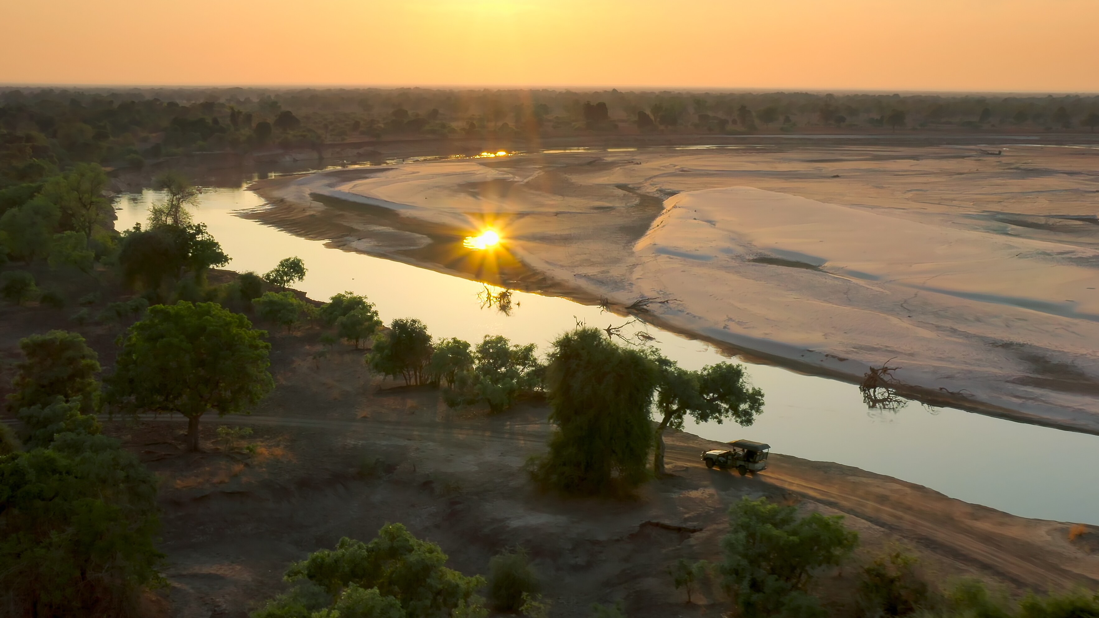 View of the the Luangwa River at sunset. (Credit: National Geographic/Bertie Gregory for Disney+)