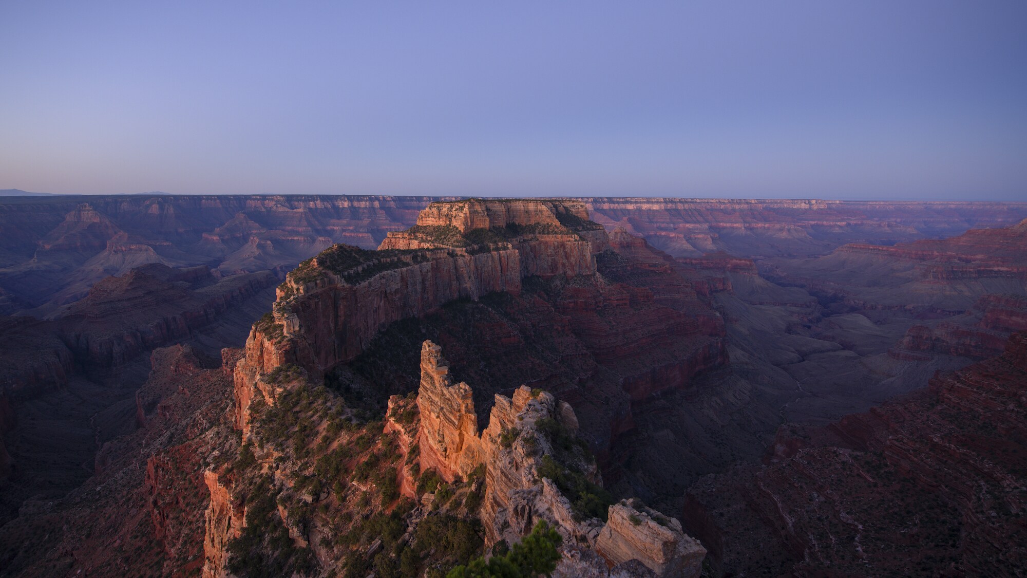 Sun rises over the sheer cliffs and barren rocks of the Grand Canyon, AZ. (National Geographic for Disney+)