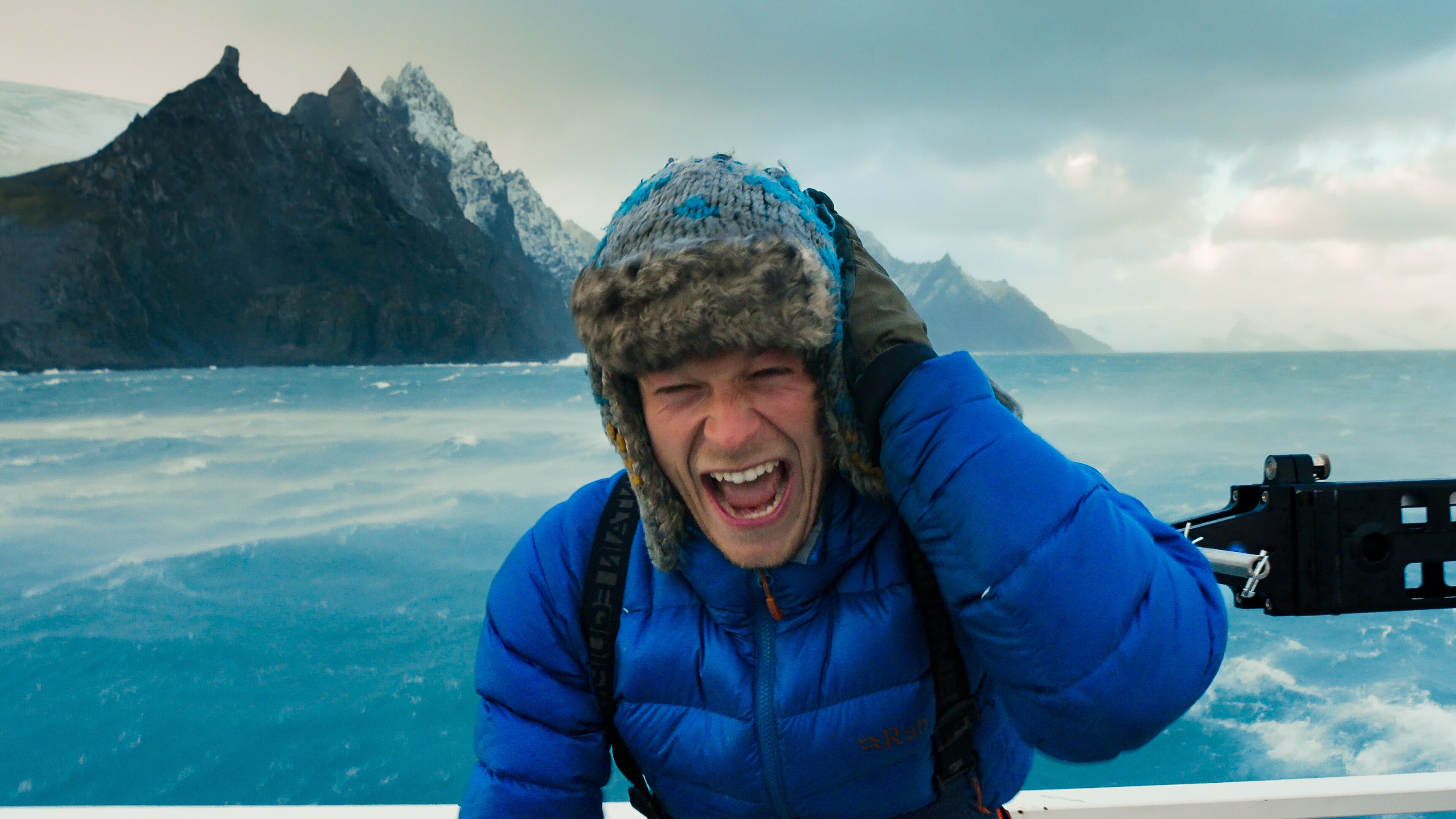 Bertie Gregory on boat in harsh Antarctic weather. (Credit: National Geographic/Will West for Disney+)