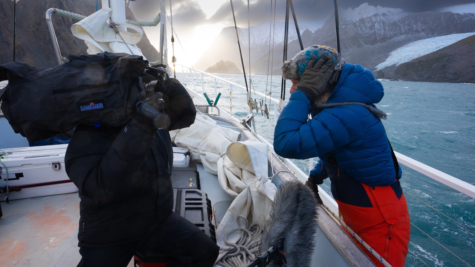 Director Will West (L) films Bertie Gregory off Elephant Island. (Credit: National Geographic/Hector Skevington-Postles)