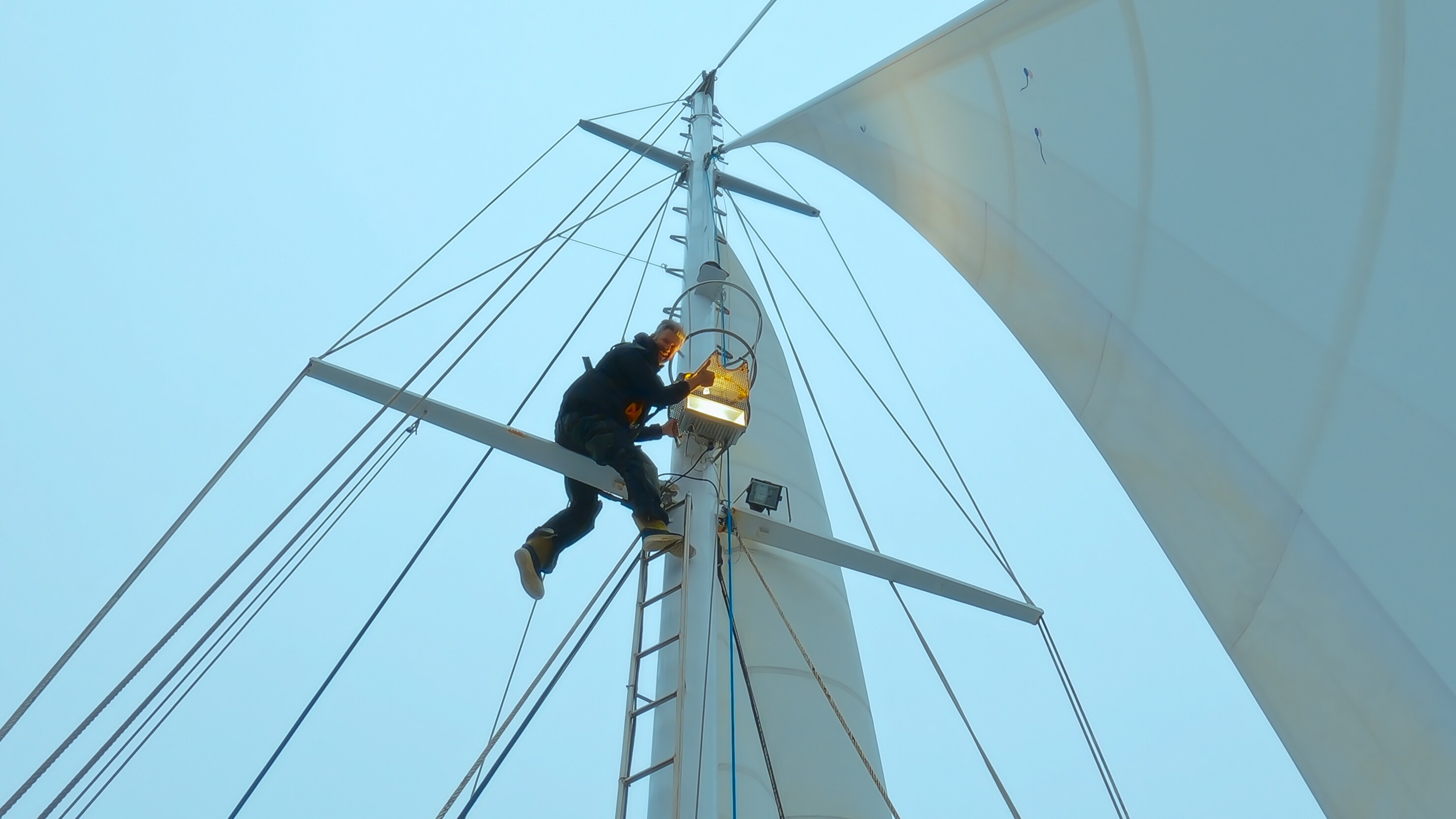Crew member working on boat. (Credit: National Geographic/Bertie Gregory for Disney+)