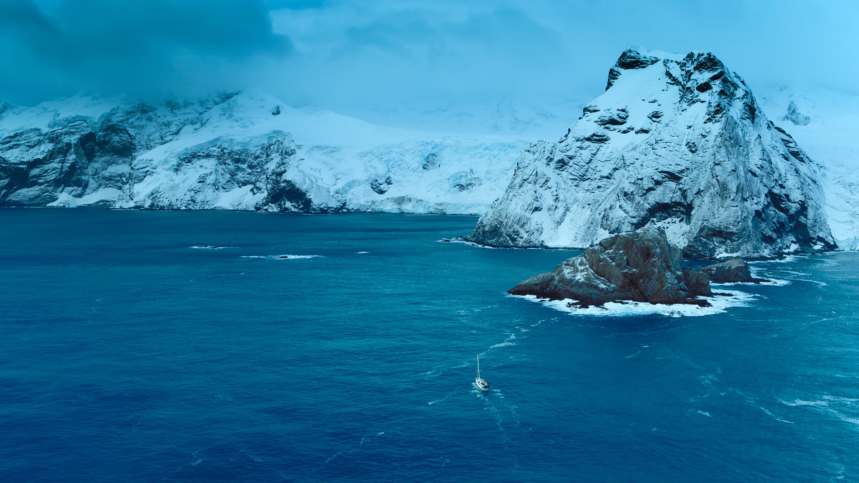 The crew seeks refuge from the brutal Antarctic weather behind Elephant island. (Credit: National Geographic/Bertie Gregory for Disney+)