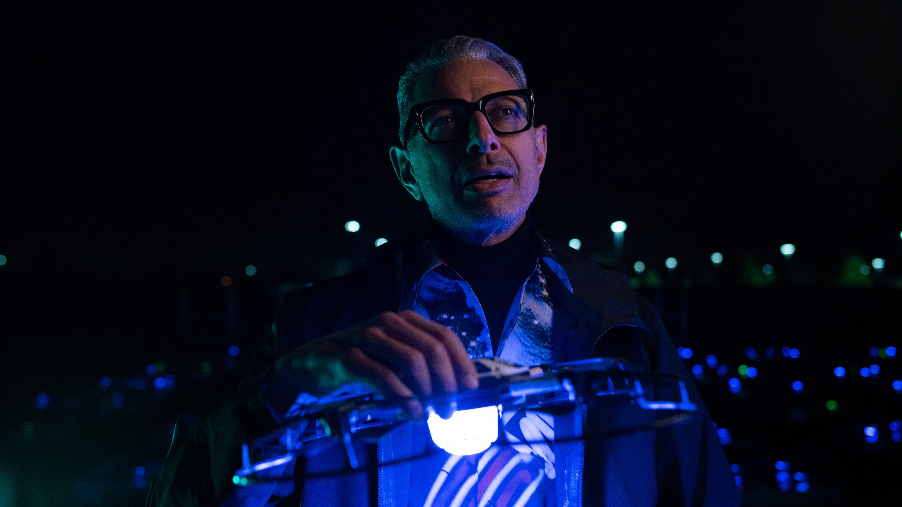 Folsom, CA - Jeff Goldblum holds an Intel drone that is used for light displays as an alternative to fireworks. (Credit: National Geographic/Justin Koenen)