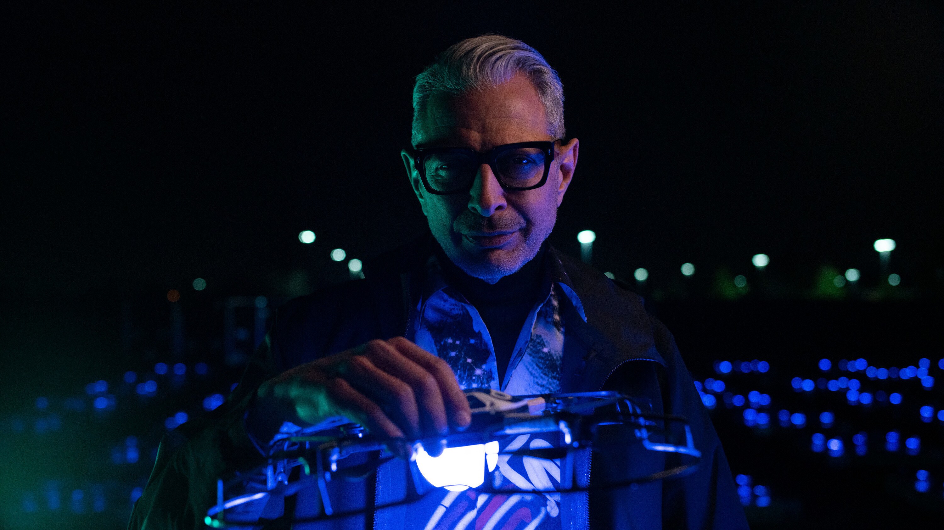 Folsom, CA - Jeff Goldblum holds an Intel drone that is used for light displays as an alternative to fireworks. (Credit: National Geographic/Justin Koenen)