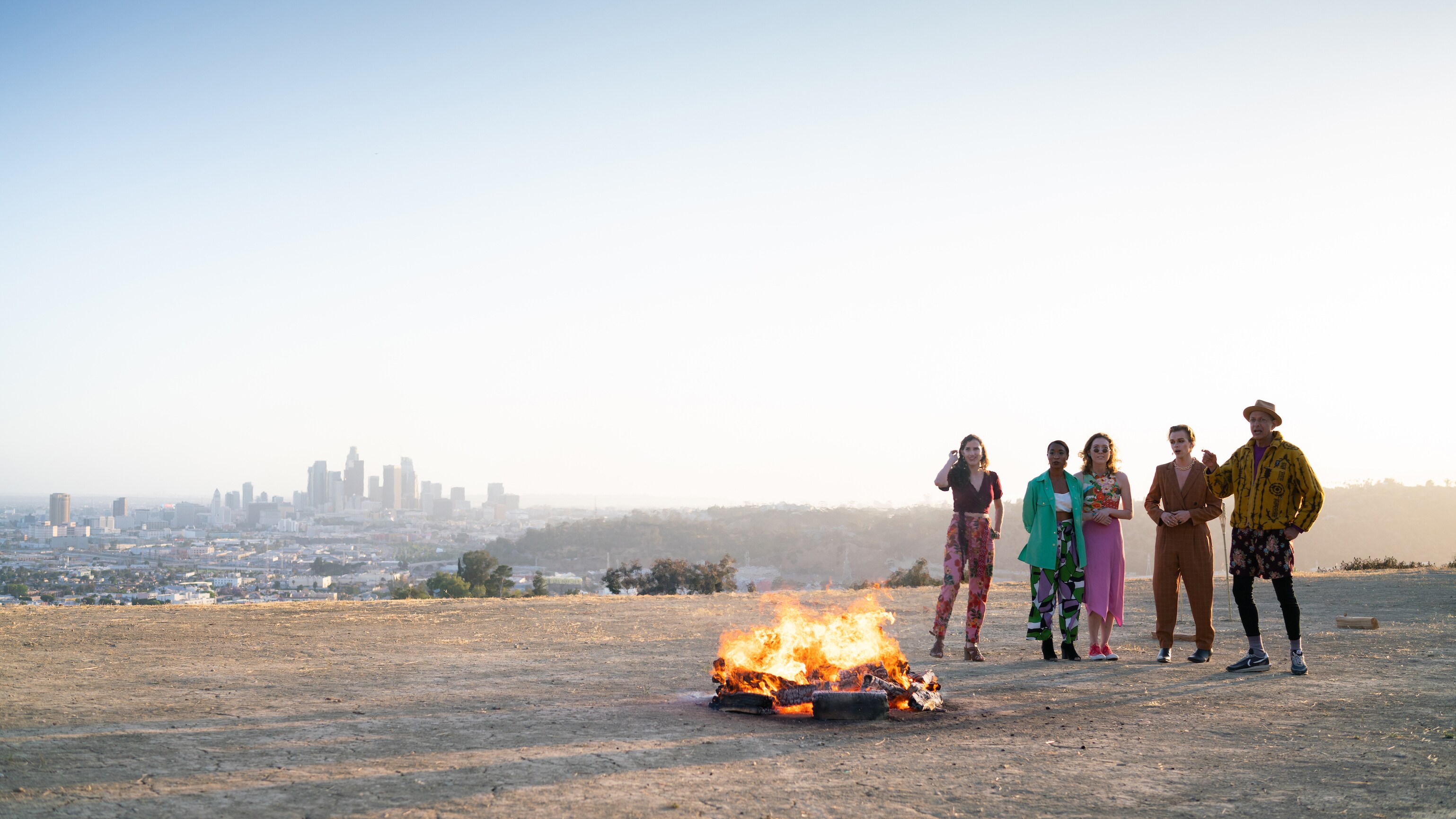 Los Angeles, CA - Jeff Goldblum (R) and firewalk participants gather around a fire. (Credit: National Geographic)