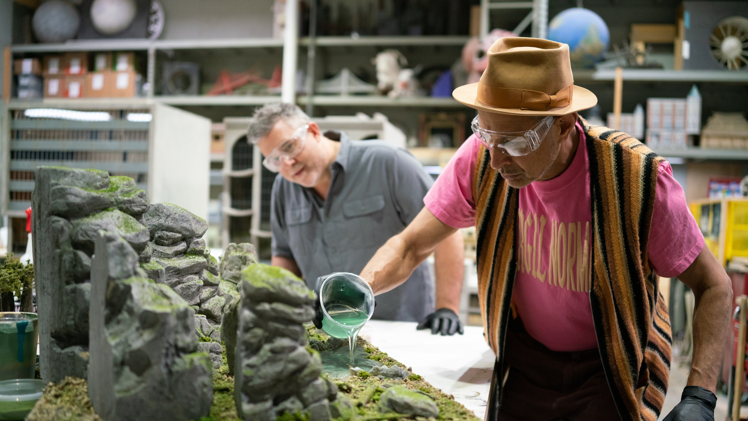 San Diego, CA - Jeff Goldblum (R) making a model scene with Carl Horner from Vision Scenery. (Credit: National Geographic)