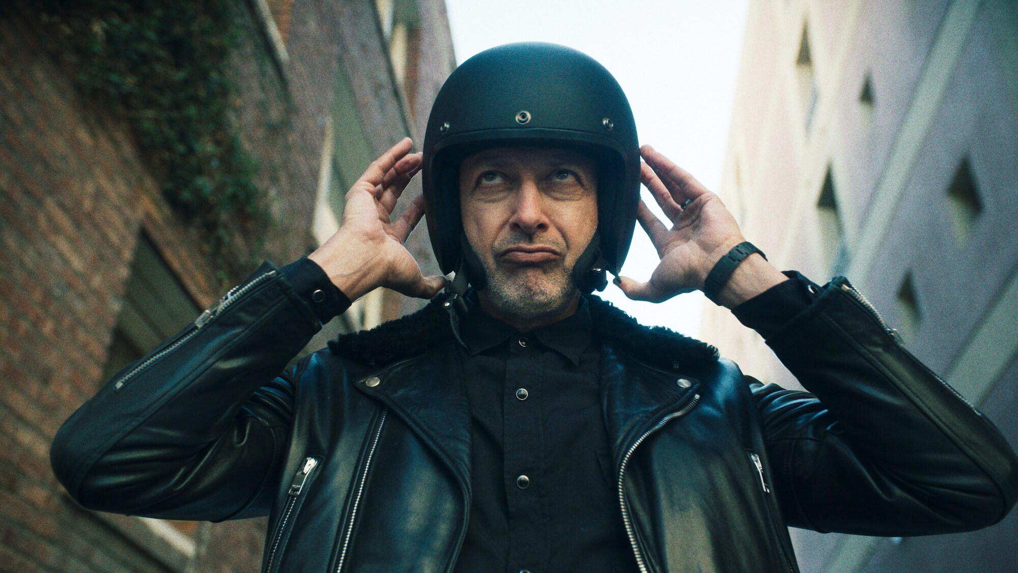 Los Angeles, CA - Jeff Goldblum wearing a motorcycle helmet. (Credit: National Geographic)