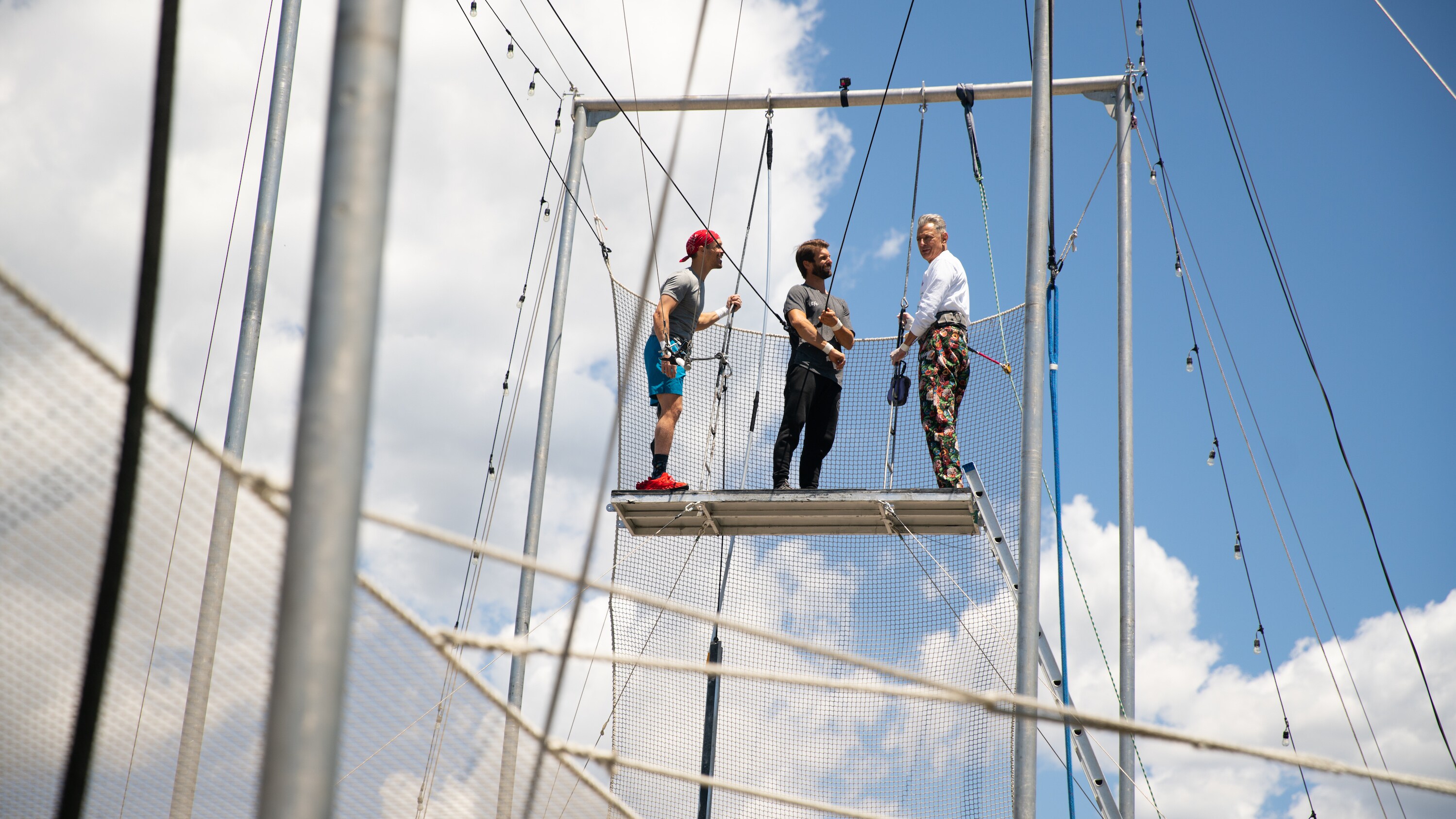 Santa Barbara, CA - Jeff Goldblum (R) prepares to try the trapeze. (Credit: National Geographic)