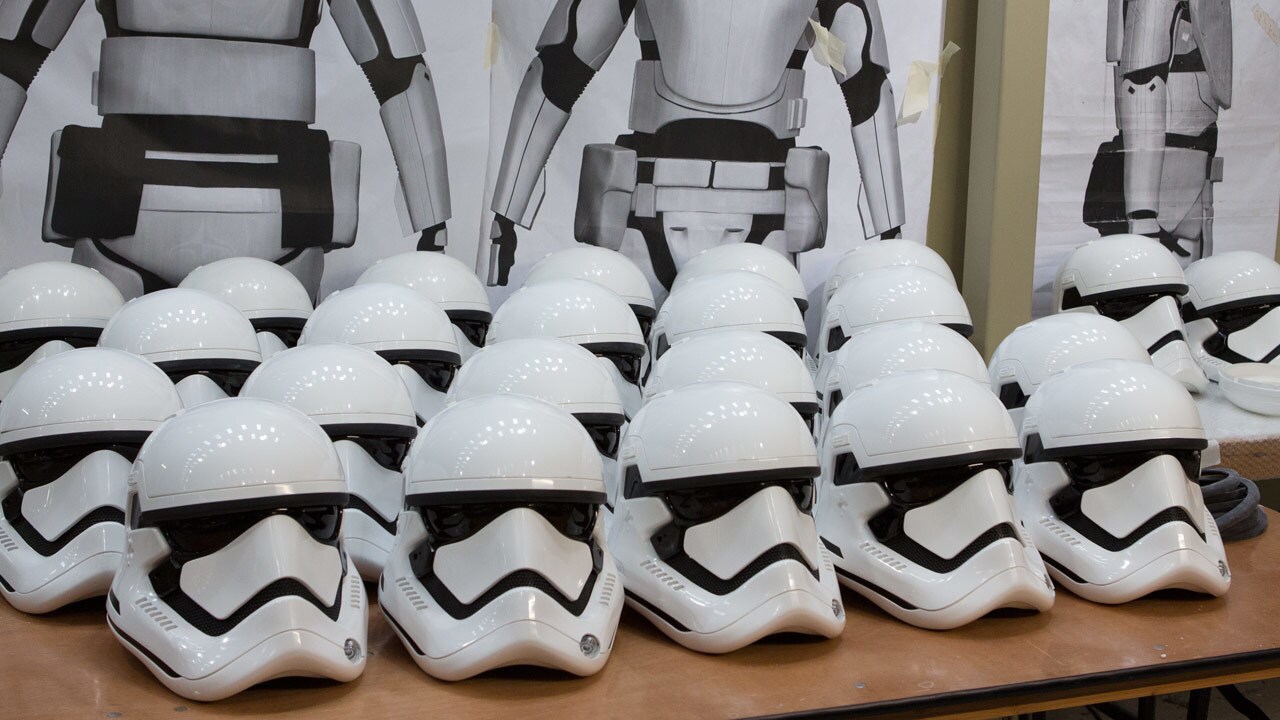 3D renders of the flametrooper armor behind finished helmets of the standard First Order stormtro...