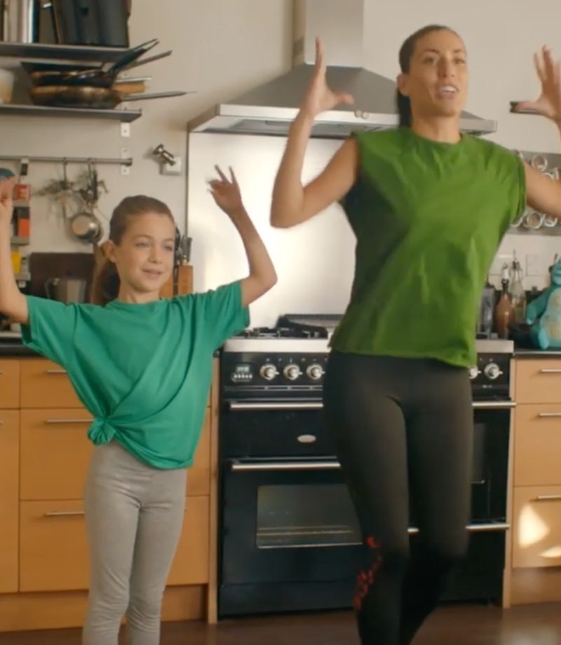 A mother and daughter exercising