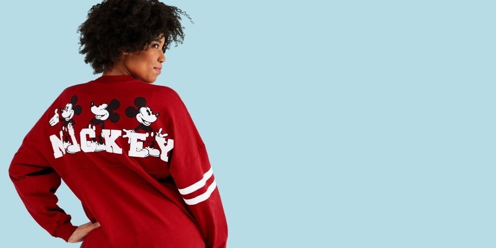 Woman in red Mickey Mouse Spirit Jersey