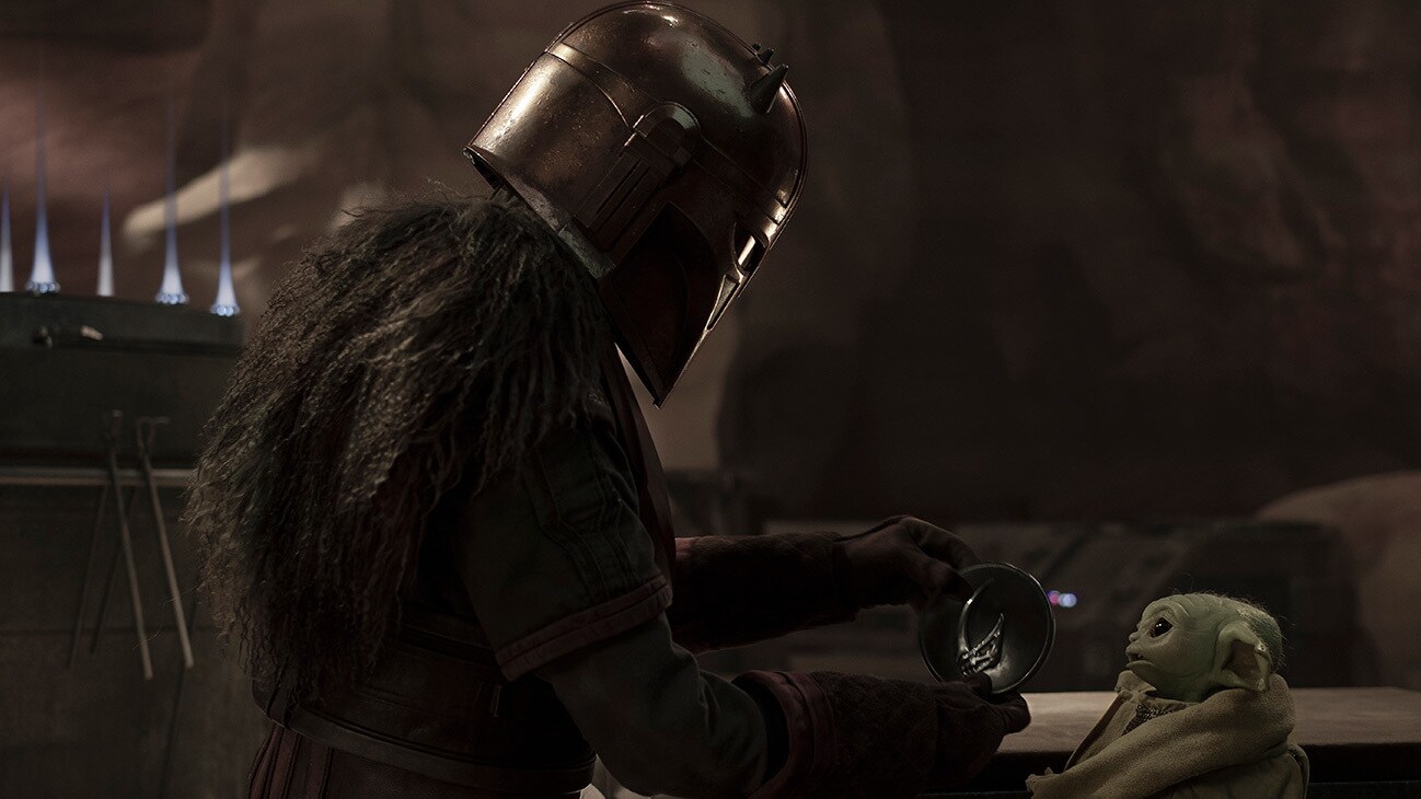 The Armorer (Emily Swallow) and Grogu in the Disney+ Original series, Star Wars: The Mandalorian, Season 3.