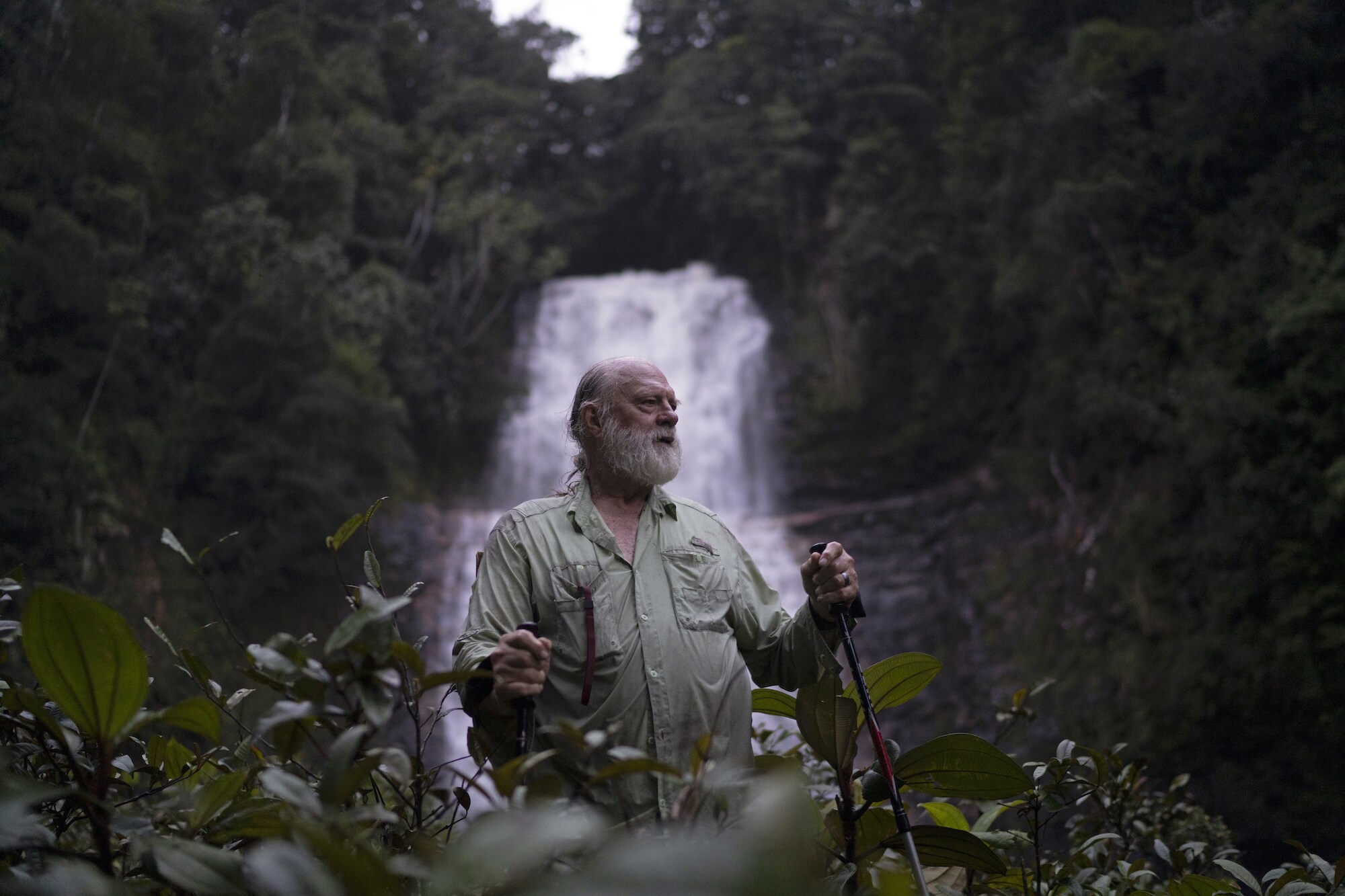 Biologist Bruce Means in front of the pristine Double Drop Falls of Guyana. (National Geographic/RYAN VALASEK)