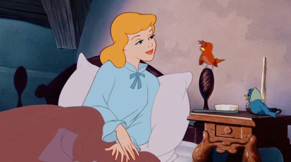 Cinderella in bed, listening to a red bird, from the animated movie "Cinderella"