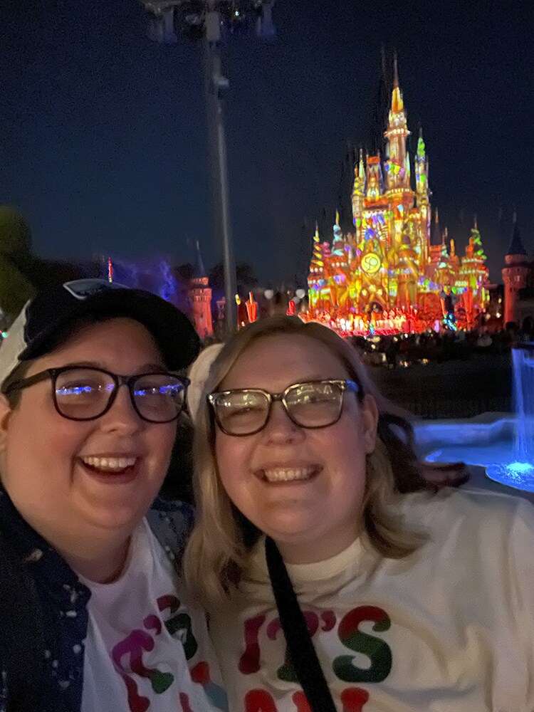 Abi and Julie with the Disney Castle behind them