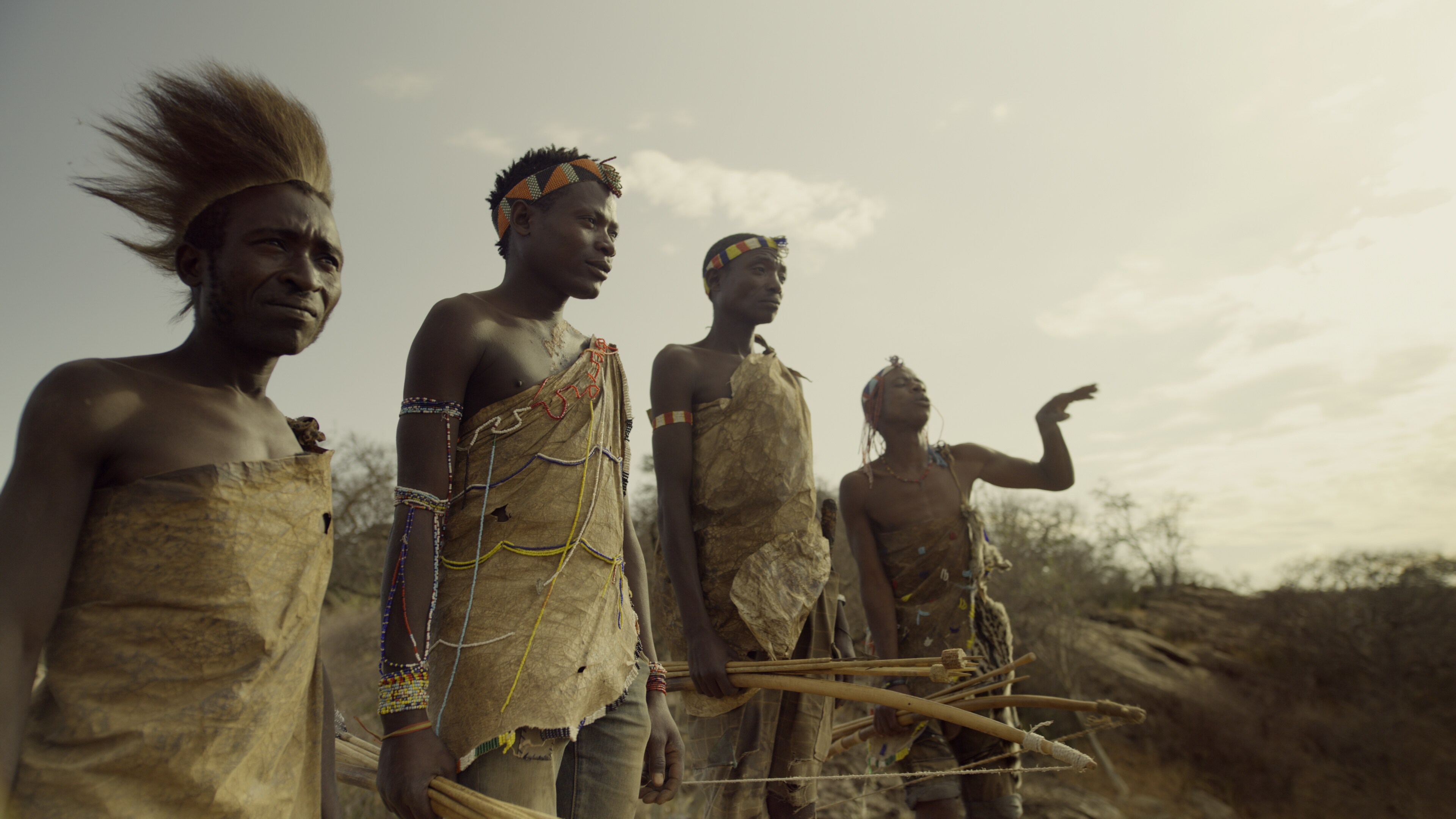 Hadza tribe members discuss their hunt. (National Geographic for Disney+)