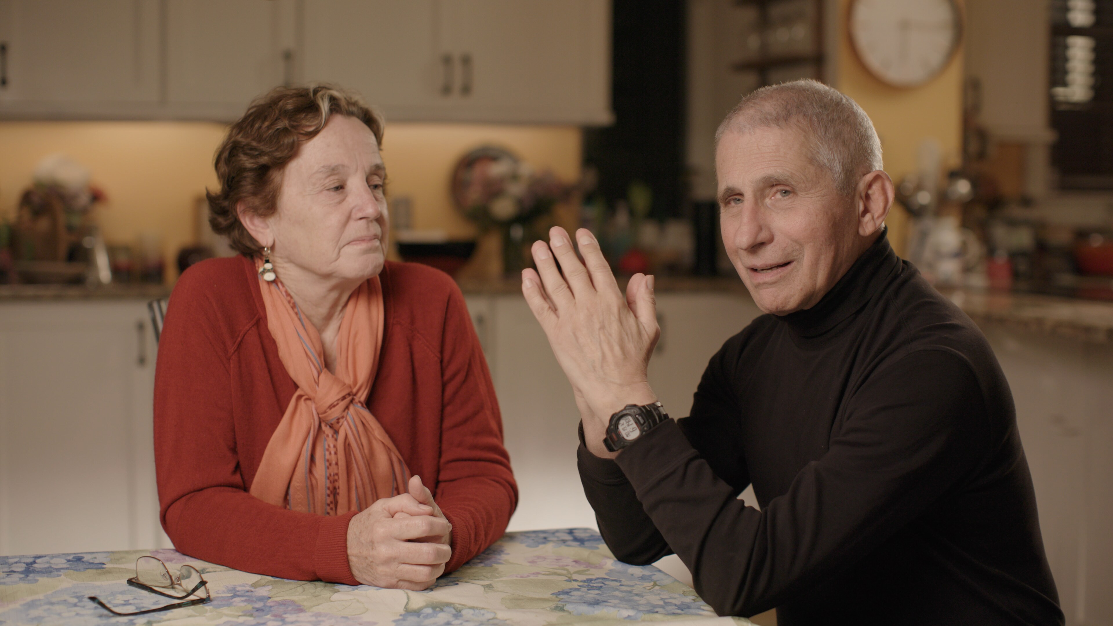 Dr. Anthony Fauci and Christine Grady sit at their kitchen table in December 2020.  (National Geographic for Disney+)