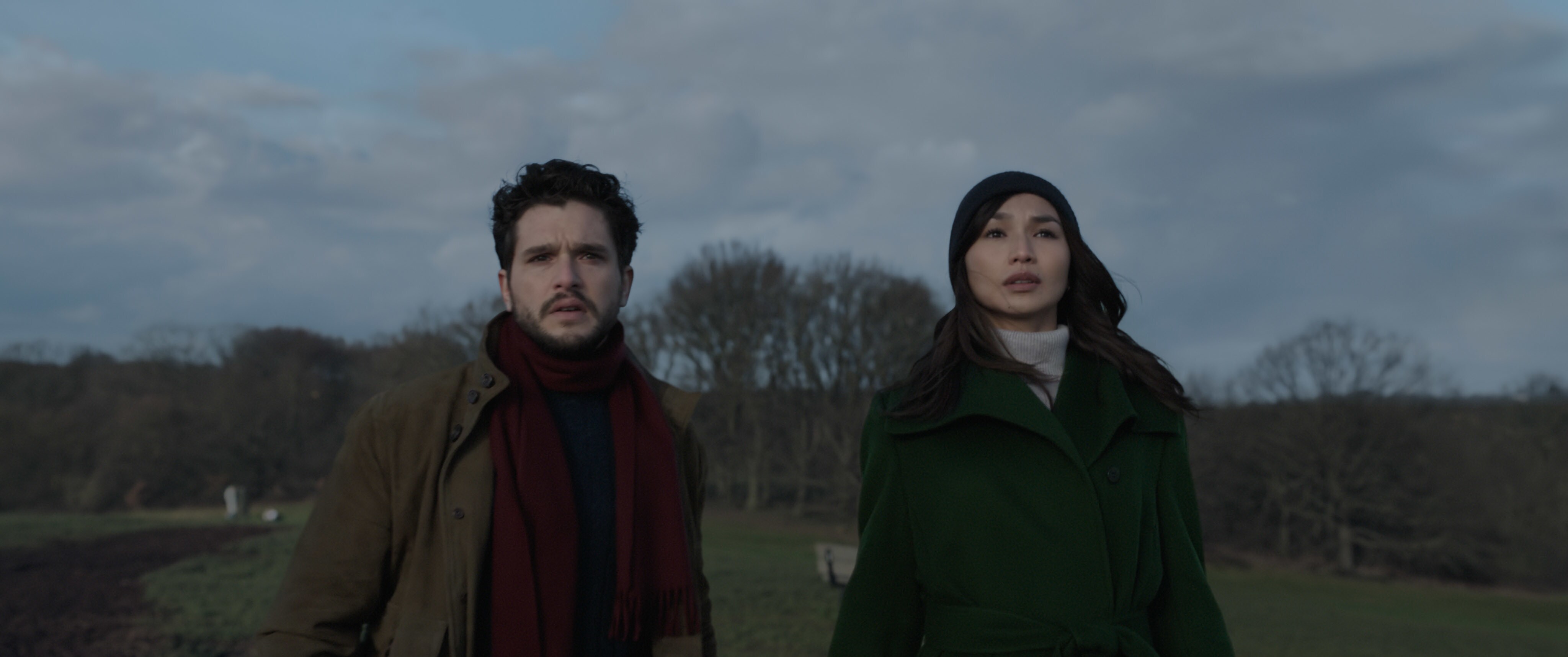 Kit Harrington as Dane Whitman and Gemma Chan as Sersi look up.