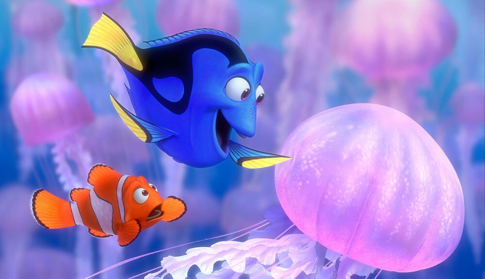 Dori and Nemo looking at a jellyfish in the movie "Finding Nemo"