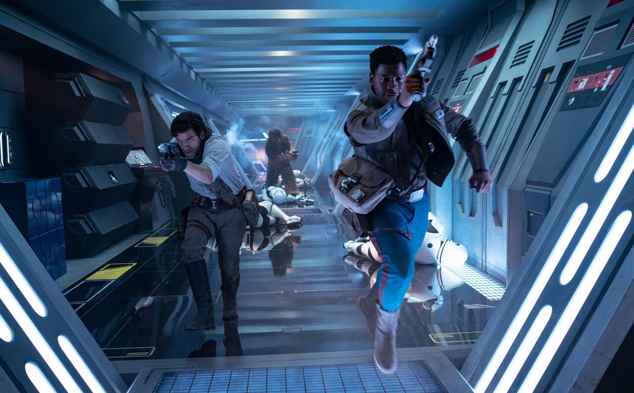 Finn and Poe rescuing Chewie