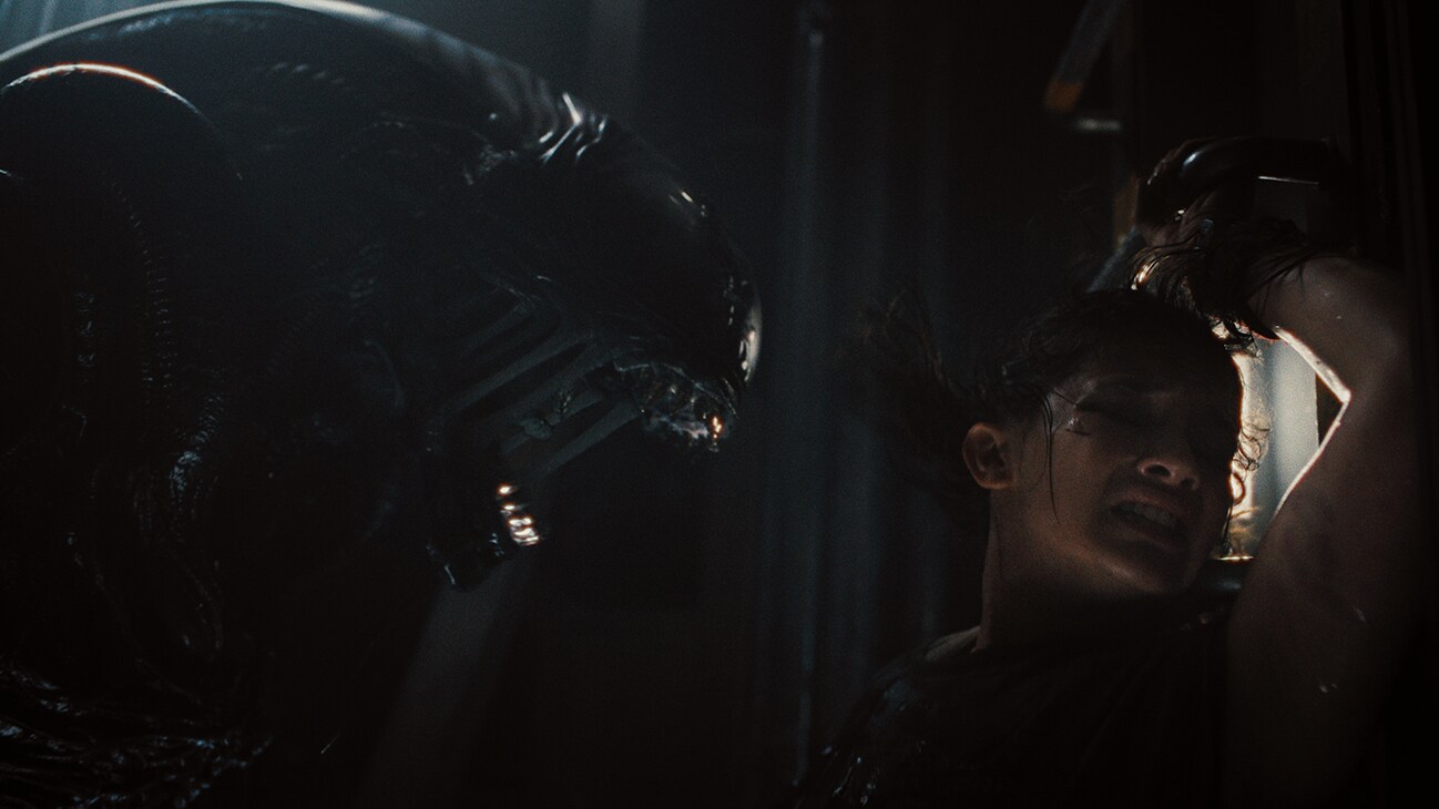 (L-R): Xenomorph and Cailee Spaeny as Rain Carradine in 20th Century Studios' ALIEN: ROMULUS. Photo courtesy of 20th Century Studios. © 2024 20th Century Studios. All Rights Reserved.