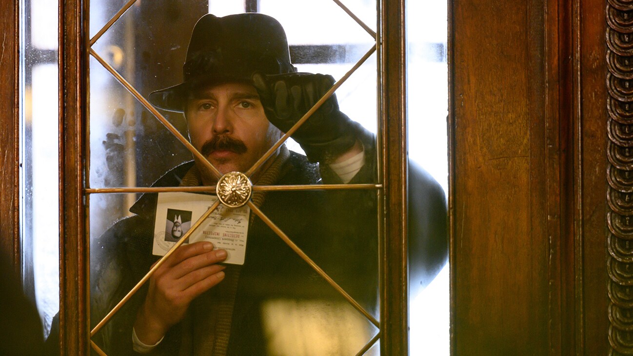 Inspector Stoppard (actor Sam Rockwell) from the Searchlight Pictures movie, "See How They Run".
