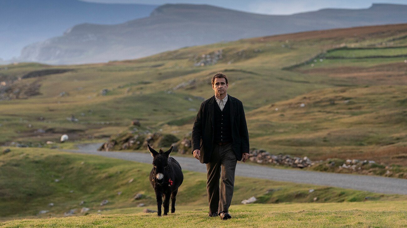 Pádraic Súilleabháin (actor Colin Farrell) walking the lowlands alongside a donkey from the Searchlight Pictures movie "The Banshees of Inisherin".