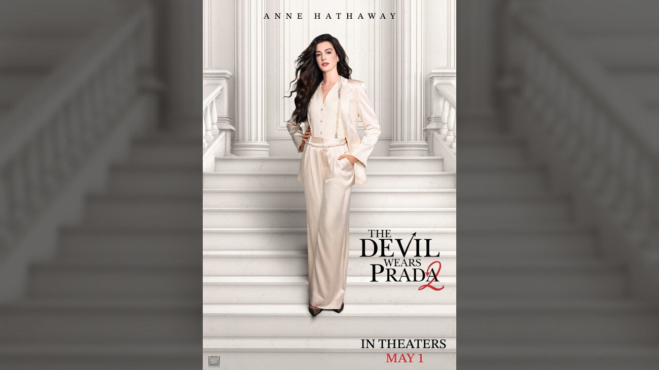 Anne Hathaway standing on a white staircase in a white pants suit. | The Devil Wears Prada 2 | May 1 | © 2026 20th Century Studios. All Rights Reserved. | movie poster