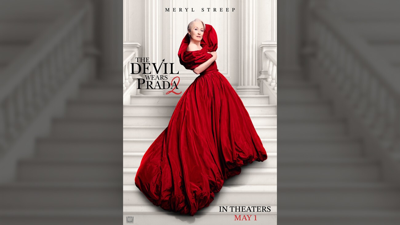 Meryl Streep standing on a white staircase in an elaborate red dress. | The Devil Wears Prada 2 |In Theaters May 1 | © 2026 20th Century Studios. All Rights Reserved. | movie poster