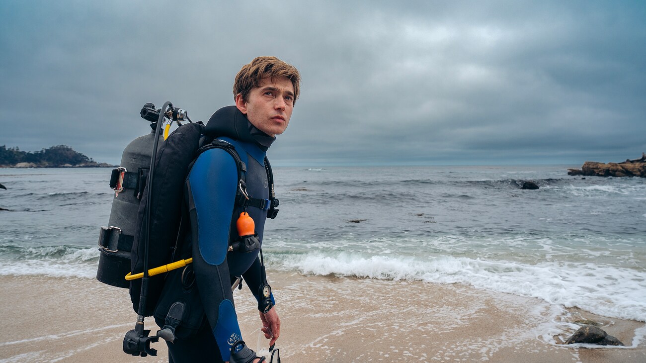 Austin Abrams as Jay Gardiner in 20th Century Studios' WHALEFALL. Photo by Jennifer Clasen. © 2026 20th Century Studios. All Rights Reserved.