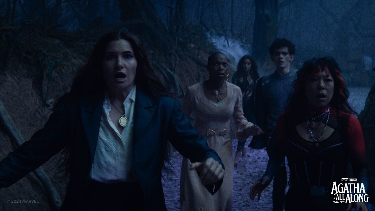 (L-R) Agatha Harkness (Kathryn Hahn), Jennifer Kale (Sasheer Zamata), Rio Vidal (Aubrey Plaza), Teen (Joe Locke) and Alice Wu-Gulliver in Marvel Television's AGATHA ALL ALONG, exclusively on Disney+. Photo courtesy of Marvel Television. © 2024 MARVEL.