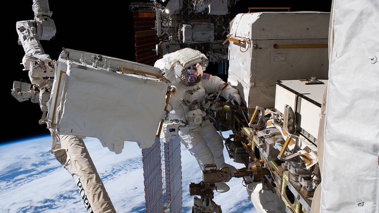 AMONG THE STARS - (Dec. 2, 2019) - NASA astronaut Andrew Morgan is tethered to the International Space Station with the Earth 250 miles below during the third spacewalk to upgrade the Alpha Magnetic Spectrometer's thermal pump system.  (NASA)  ANDREW MORGAN