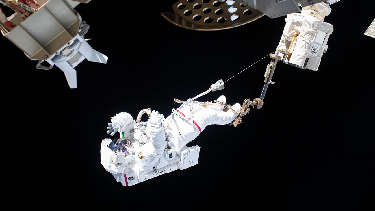 AMONG THE STARS - (Nov. 22, 2019) --- Astronaut Luca Parmitano of ESA (European Space Agency) is attached to an articulating portable foot restraint at the end of the Canadarm2 robotic arm during the second spacewalk to repair the International Space Station's cosmic particle detector, the Alpha Magnetic Spectrometer. (NASA)  LUCA PARMITANO