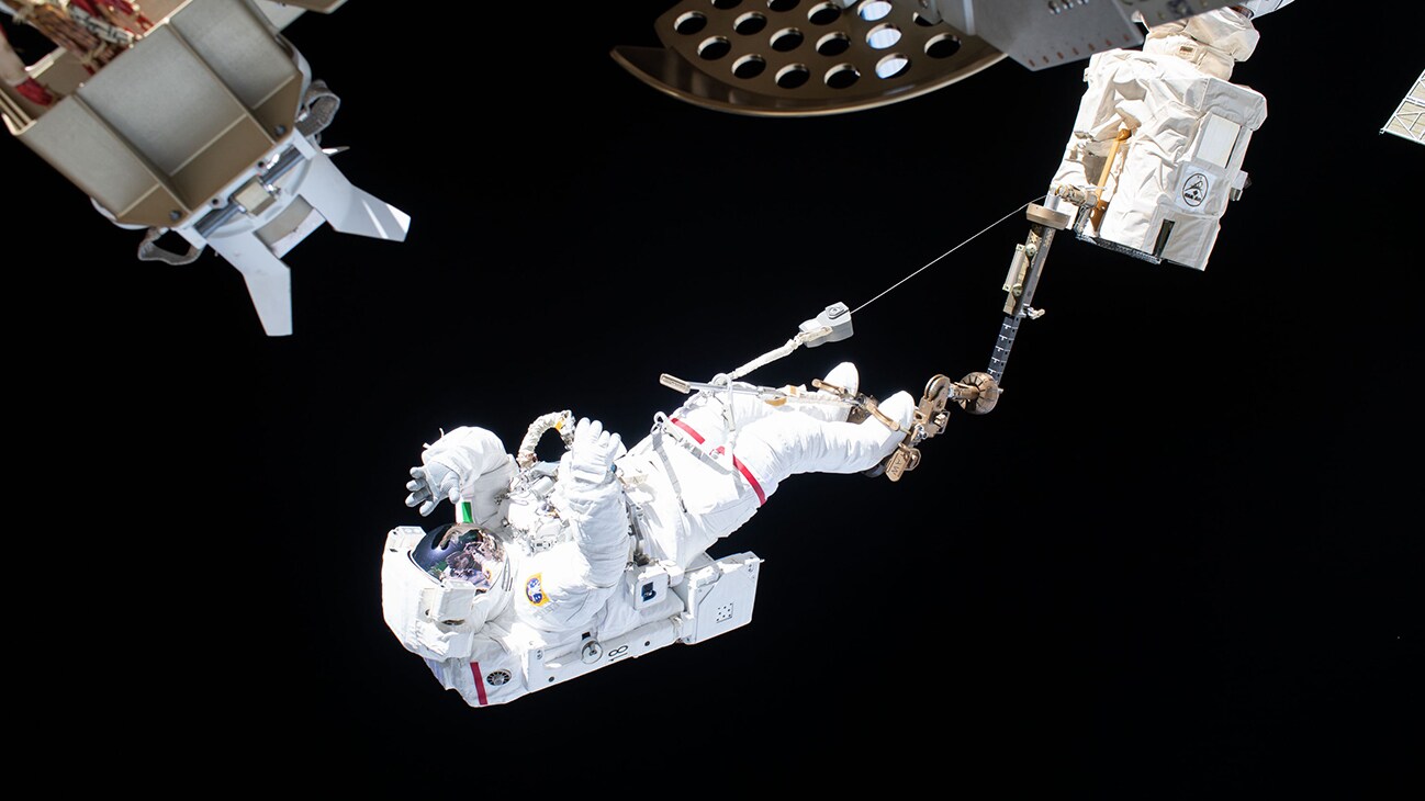AMONG THE STARS - (Nov. 22, 2019) --- Astronaut Luca Parmitano of ESA (European Space Agency) is attached to an articulating portable foot restraint at the end of the Canadarm2 robotic arm during the second spacewalk to repair the International Space Station's cosmic particle detector, the Alpha Magnetic Spectrometer. (NASA) LUCA PARMITANO