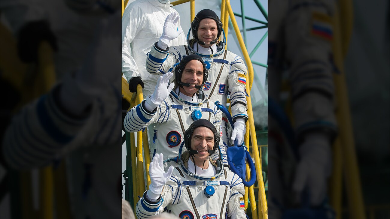 AMONG THE STARS - Expedition 63 crewmembers Ivan Vagner of Roscosmos, top, Chris Cassidy of NASA, center, and Anatoly Ivanishin wave goodbye as they prepare to climb aboard the Soyuz MS-16 rocket at Site 31 at the Baikonur Cosmodrome in Kazakhstan, Thursday, April 9, 2020. They launched a short time later to the International Space Station for the start of a six-and-a-half month mission. (NASA/GCTC/Andrey Shelepin)  IVAN VAGNER, CHRIS CASSIDY, ANATOLY IVANISHIN