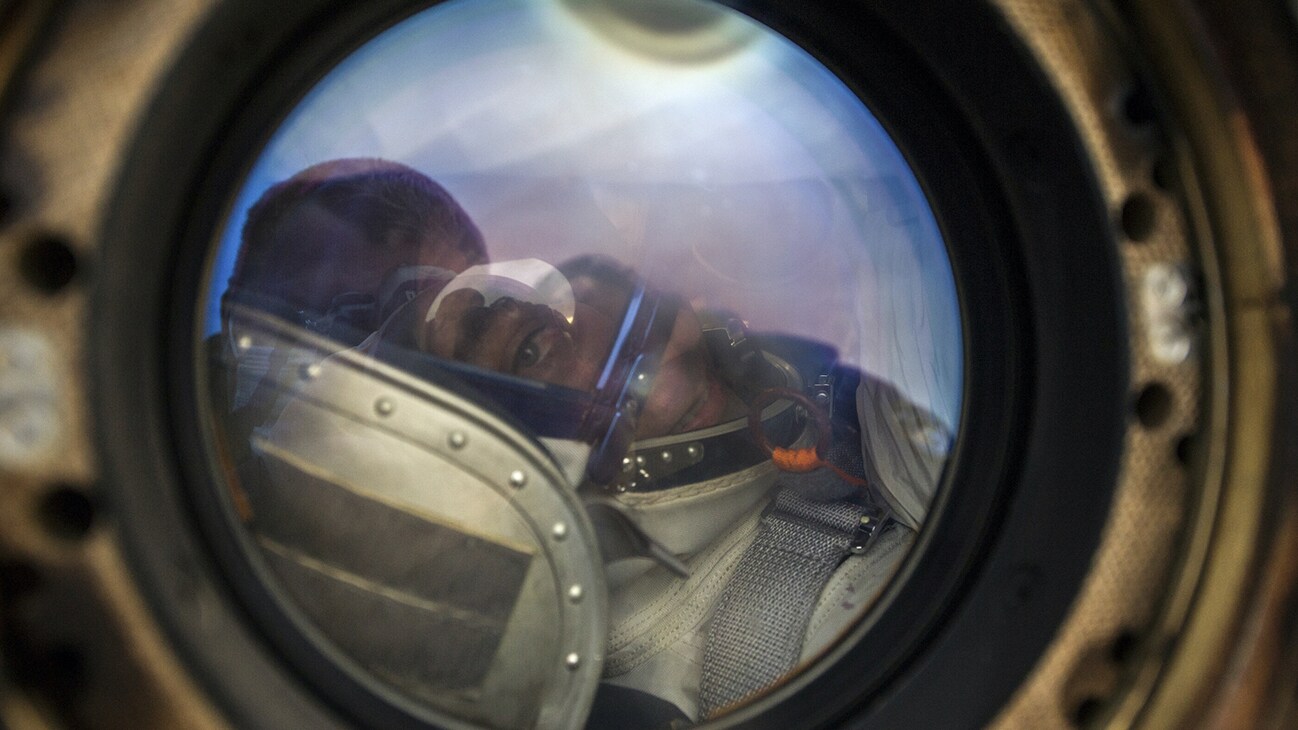 AMONG THE STARS - Expedition 63 NASA astronaut Chris Cassidy smiles from inside the Soyuz MS-16 spacecraft just minutes after he and Roscosmos cosmonauts Ivan Vagner, and Anatoly Ivanishin, landed in a remote area near the town of Zhezkazgan, Kazakhstan on Thursday, October 22, 2020, Kazakh time (Oct. 21 Eastern time). Cassidy, Ivanishin and Vagner returned after 196 days in space having served as Expedition 62-63 crew members onboard the International Space Station. (NASA/GCTC/Denis Derevtsov)  CHRIS CASSIDY