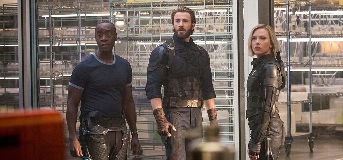 Don Cheadle as James Rhodes, Chris Evans as Captain America, and Scarlett Johansson as Black Widow at headquarters in Avenergs: Infinity War