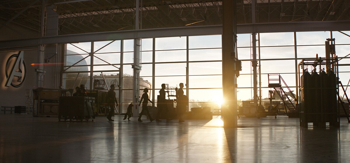 The remaining Avengers walk through a hangar