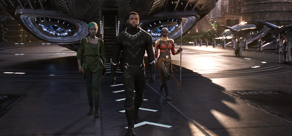 Chadwick Boseman as Black Panther walking from plane in the film "Black Panther"