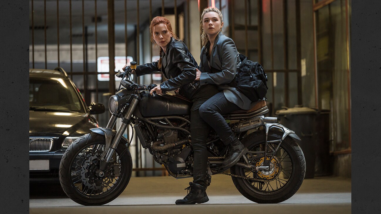 Scarlett Johansson as Black Widow/Natasha Romanoff and Florence Pugh as Yelena in Marvel Studios' BLACK WIDOW. Photo by Jay Maidment. ©Marvel Studios 2020. All Rights Reserved.