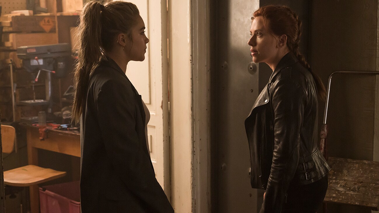 (L-R) Yelena (Florence Pugh) and Black Widow/Natasha Romanoff (Scarlett Johansson) in Marvel Studios' Black Widow. Photo by Jay Maidment. ©Marvel Studios 2021. All Rights Reserved.