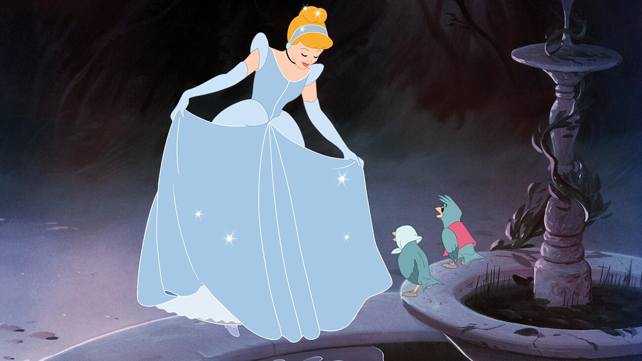 Cinderella showing her new dress to her animal friends.