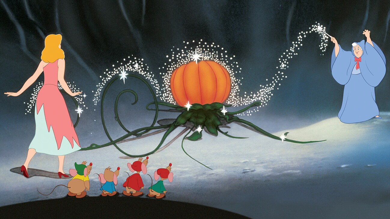 Fairy Godmother transforming a pumpkin into a carriage.