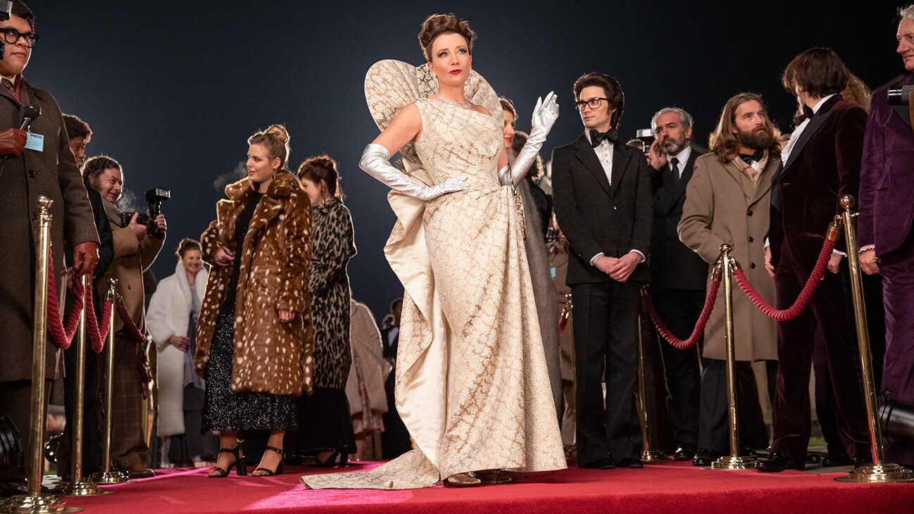 Emma Thompson as the Baroness and Andrew Leung as Jeffrey in Disney’s live-action CRUELLA. Photo by Laurie Sparham. © 2021 Disney Enterprises, Inc. All Rights Reserved.