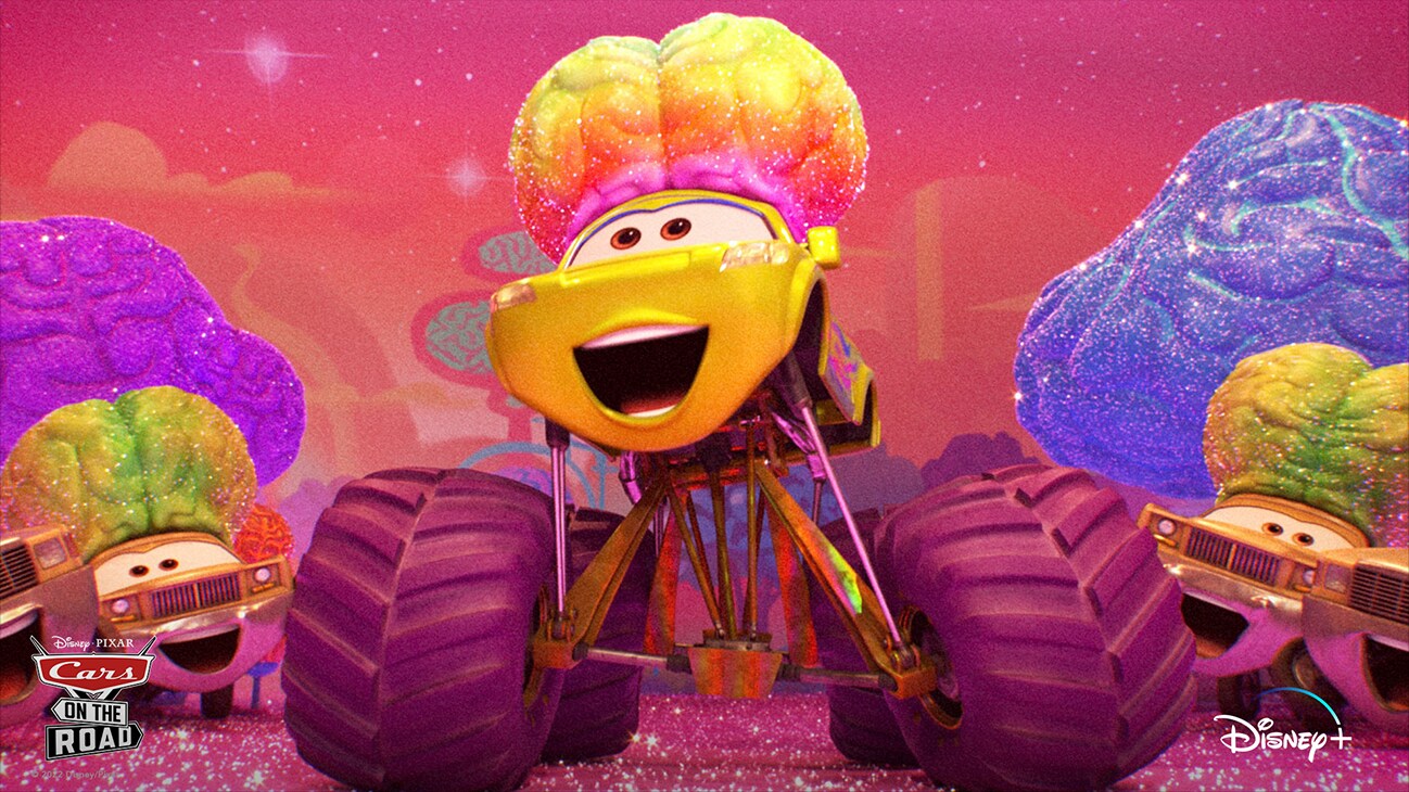 A car with large monster truck wheels and a large brain in between two smaller cars with large brains from the Disney+ Original series "Disney•Pixar Cars on the Road".